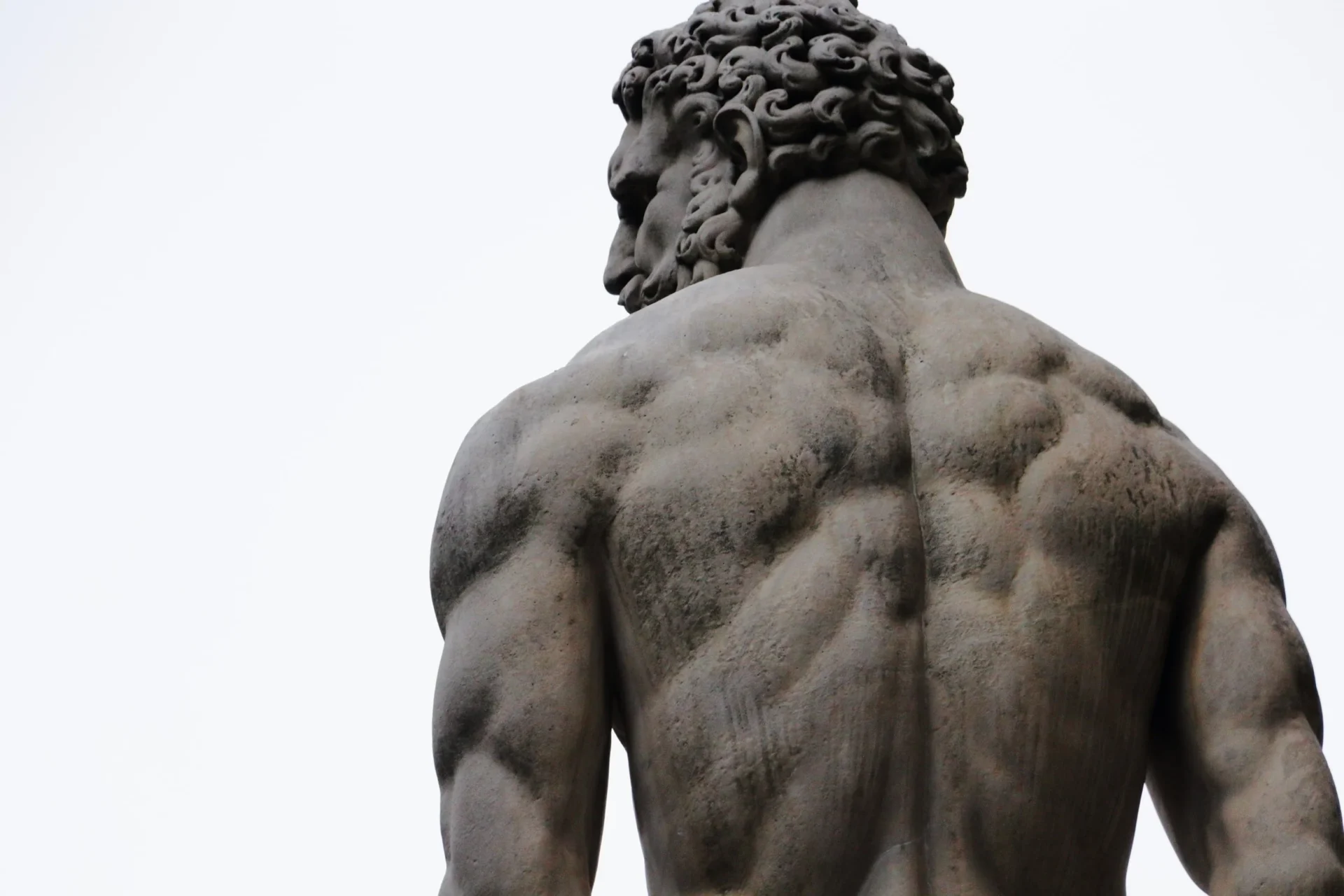 Classical Greek marble statue seen from behind at Zorba The Greek Taverna Singapore